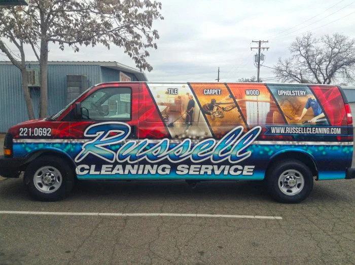 Russell Cleaning Service Van parked on the road